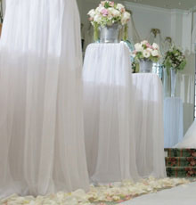 Columns with ice buckets of floral